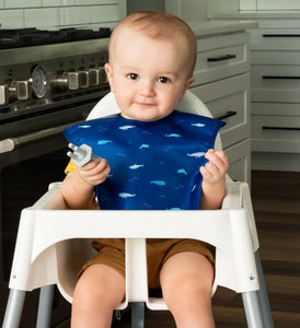 baby boy using Tiny Twinkle's Ocean Life Easy Bib