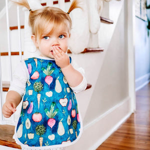 Toddler using BapronBaby Organic Produce Bapron Bib-Apron